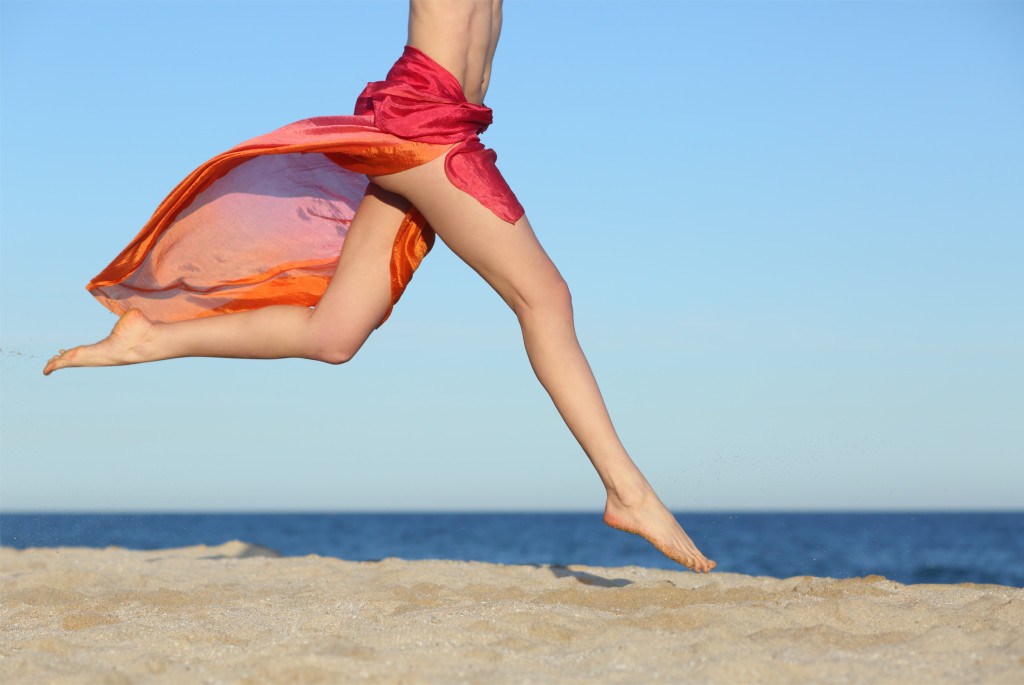Woman on beach with smooth legs